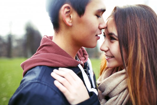 Young man and woman showing affection