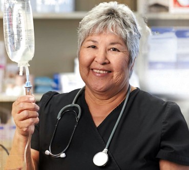 Indigenous nurse with IV bag