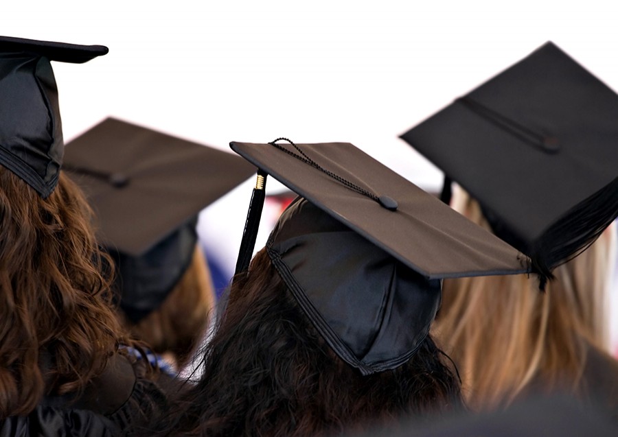 group of graduates wearing the traditional cap and gown