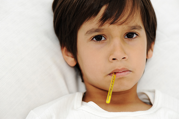 Young boy with thermometer